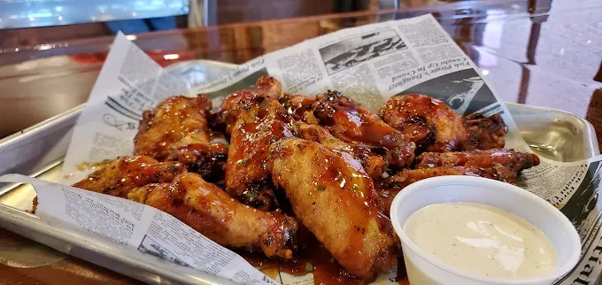 Basket of saucy smoked wings with ranch